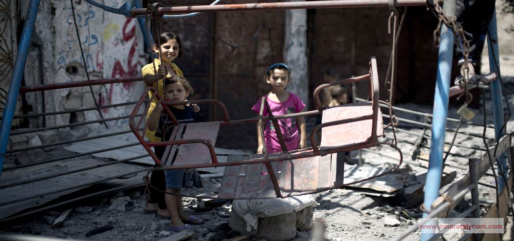 صور التقطتها عدسات الكاميرات لما يشاهده ويعيشه الأطفال في غزة خلال أيام عيد الفطر. الصور من أ ف ب و أ ب