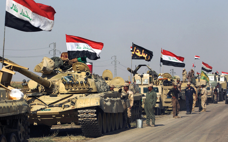 قوات الجيش العراقي متوقفة إلى جانب مواقع للبيشمركة. أ.ف.ب