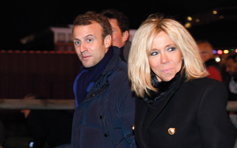 ماكرون وزوجته برجيت ماكرون. أ.ف.ب