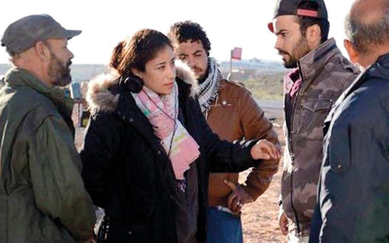 المخرجة سارة العبيدي خلال تصوير الفيلم.

أرشيفية