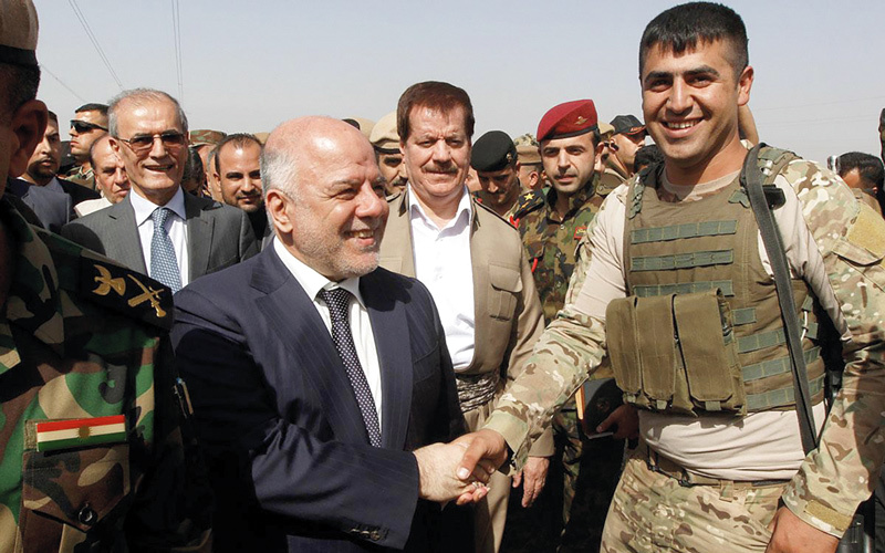 العبادي يسعى إلى بناء عراق جديد يتعدى الطائفية.  أرشيفية