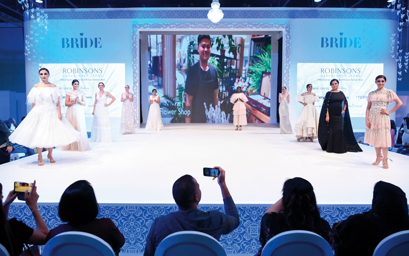 المعرض منصة تقدم أحدث صيحات الموضة لفساتين الأعراس والسهرة ومستلزمات الأعراس من زفات وكوشة وتصوير. تصوير: أحمد عرديتي