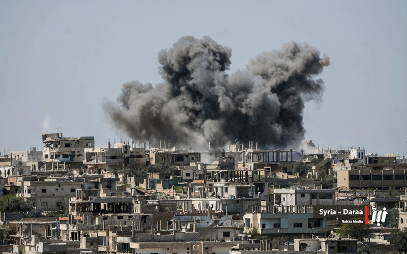 سحب من الدخان فوق درعا نتيجة القصف السوري قبل  اتفاق الهدنة.    أ.ب