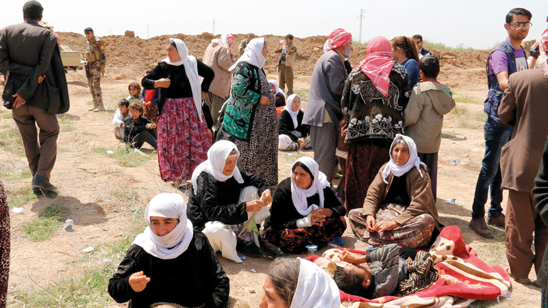 أيزيديات بعد الإفراج عنهن من قبضة «داعش».  إي.بي.إيه