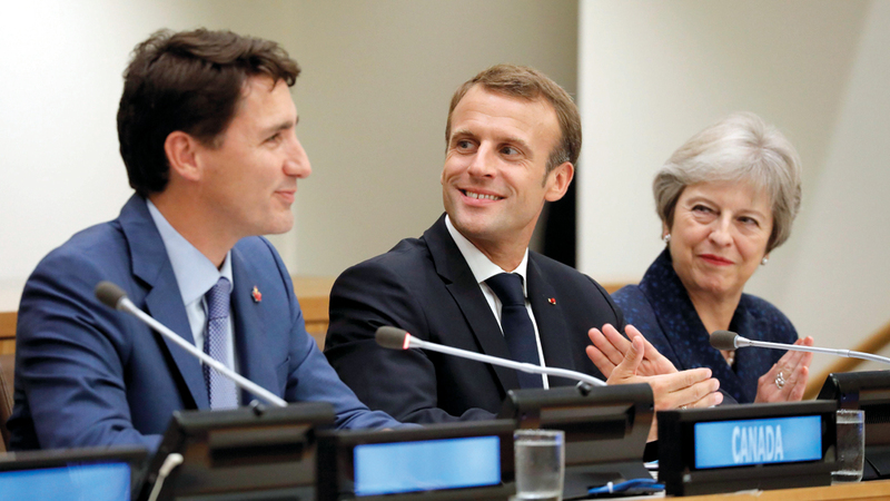 الزعماء ماي وماكرون وترودو يشاركون في فعالية «تعليم الفتيات». أ.ف.ب