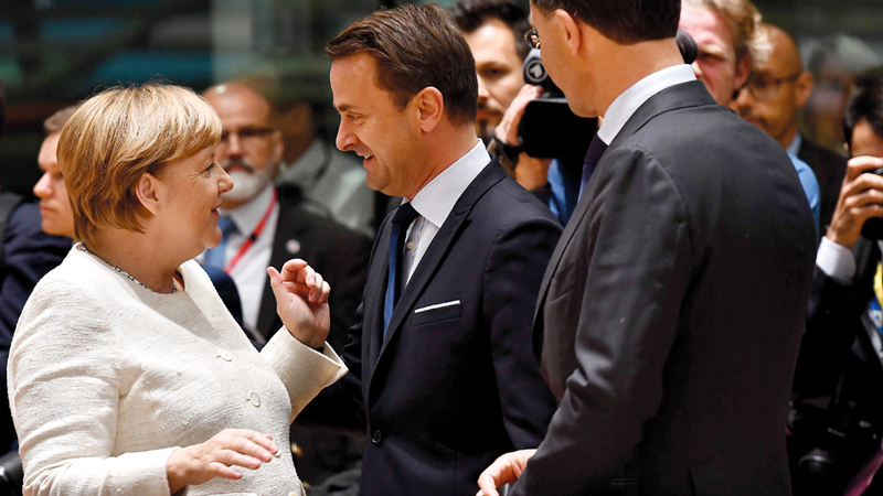 ميركل خلال قمة بروكسل.  أ.ف.ب