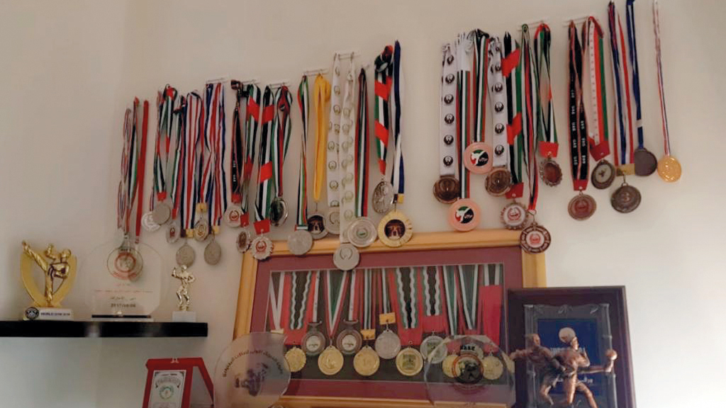 جانب من ميداليات وكؤوس محمد عبدالكريم. من المصدر