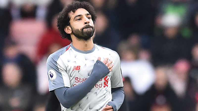 محمد صلاح منتشياً بتسجيله 3 أهداف في مرمى بورنموث. أ.ف.ب