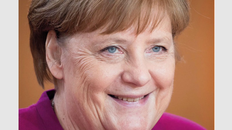 المستشارة الألمانية أنغيلا ميركل اعتادت تدوير الملابس.  أ.ف.ب