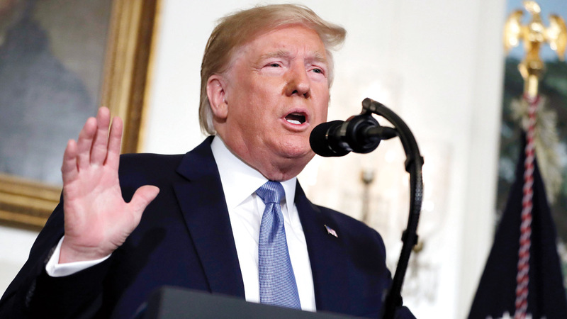 ترامب تعهد بعدم حرمان الأميركيين من حمل السلاح طالما بقي رئيساً. أ.ب