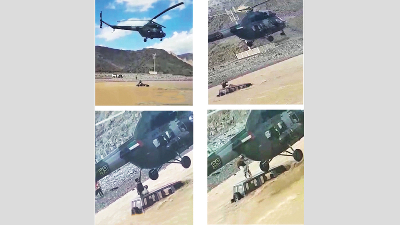 لقطات تظهر عملية إنقاذ اليماحي شاباً تعطلت مركبته في وادي البيح أخيراً.  من المصدر