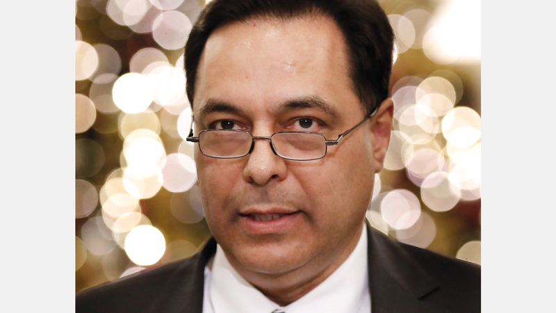 حسان دياب ترأس أول حكومة في تاريخ لبنان تدين بالفضل لائتلاف برلماني يقوده «حزب الله». أ.ب