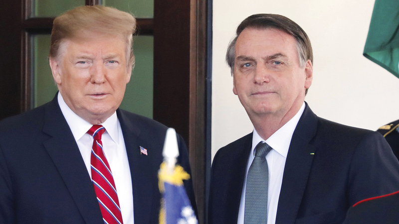 ترامب وبولسونارو يفاقمان التكاليف الباهظة الناجمة 	عن انعدام المساواة بالدخل.  أرشيفية