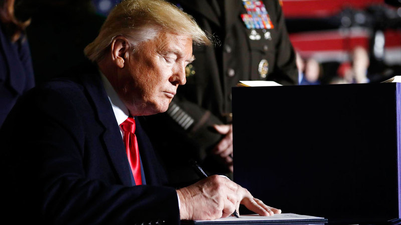 ترامب يوقع على قانون قيصر.  أرشيفية