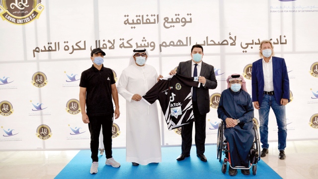 صورة شراكة بين «دبي لأصحاب الهمم» وفريق لافال لكرة القدم – رياضة – محلية
