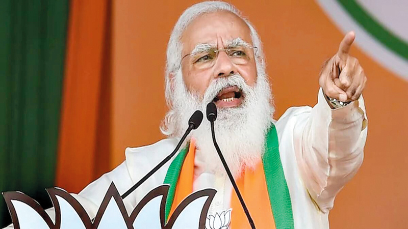 مودي ظهر في تجمع انتخابي دون كمامة.   غيتي