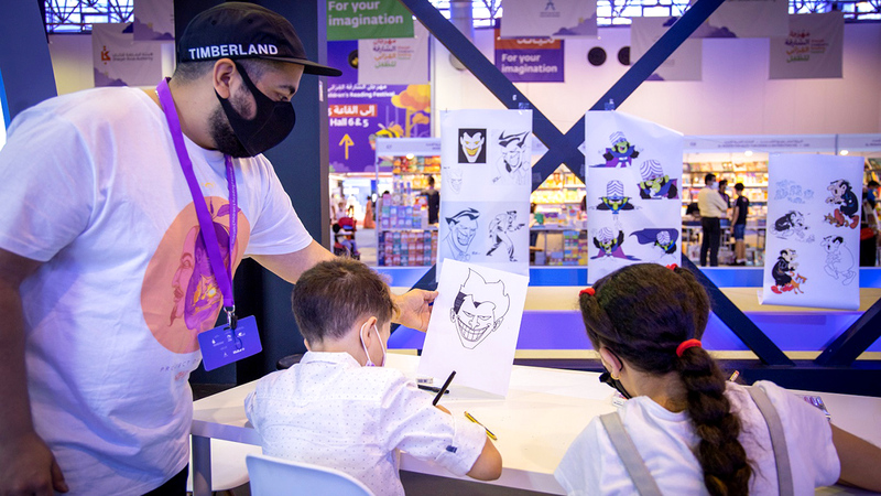 من ورشة فنية في «محطة الكوميكس » حول ملامح أبطال الرسوم المتحركة.  من المصدر