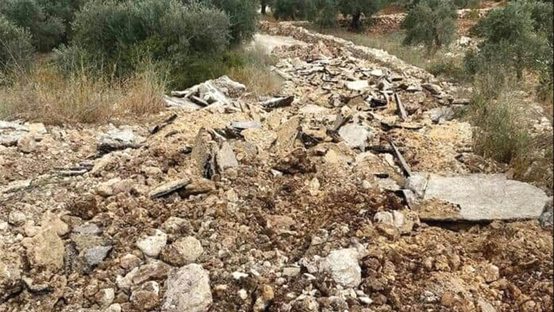 جانب من تدمير شارع ومدخل رأس كركر. الإمارات اليوم