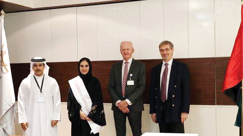 المهيري خلال تكريمها داخل الهيئة كأول سفيرة سعادة. أرشيفية