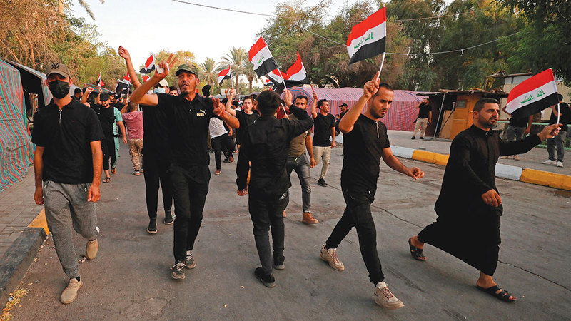 أنصار الإطار التنسيقي يتظاهرون في المنطقة الخضراء.   أ.ف.ب