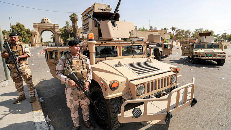 قوات الجيش العراقي تحرس مدخل المنطقة الخضراء في بغداد. أ.ف.ب
