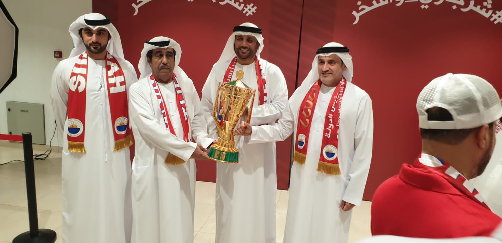 Sharjah fans celebrate with the administration and take souvenir photos