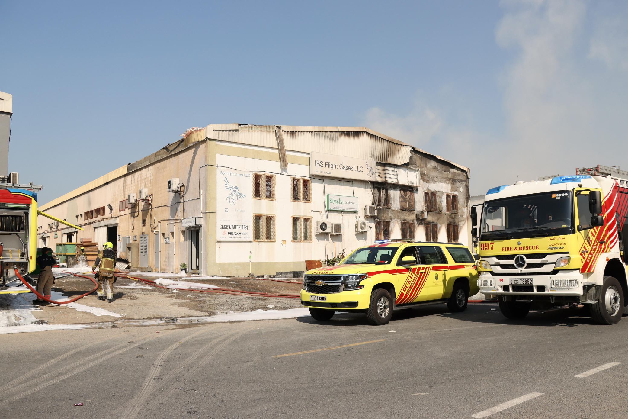 Dubai Civil Defense controls a fire in a warehouse containing flammable