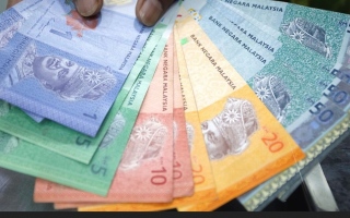 الصورة: ماليزية تخسر 292 ألف دولار في محاولتها لاسترجاع 366 دولاراً من عملية احتيال