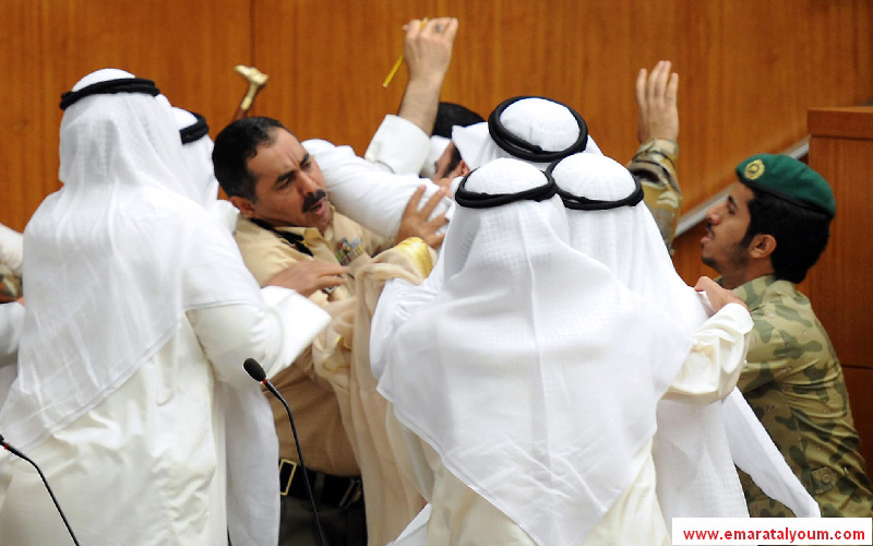 وتبادل النواب اللكمات والضرب بالعقل-أ.ف.ب