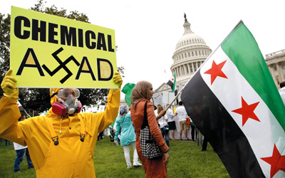 تظاهرة أمام مبنى الكونغرس تؤيد توجه أوباما بتنفبذ ضربة عسكريةلنظام الأسد . رويترز