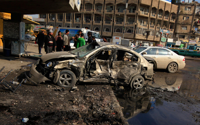آثار أحد التفجيرات التي استهدفت بغداد أمس. رويترز
