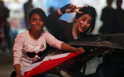 جماهير خرجت إلى شوارع العراق احتفالاً بالتأهل. أ.ف.ب