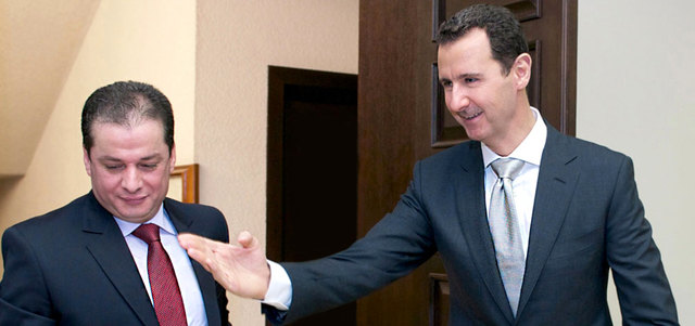 الأسد لدى استقباله الحجار. أ.ف.ب