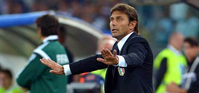 مدرب إيطاليا كونتي سعيد بفوزه في أول مباراة مع الآزوري. أ.ف.ب