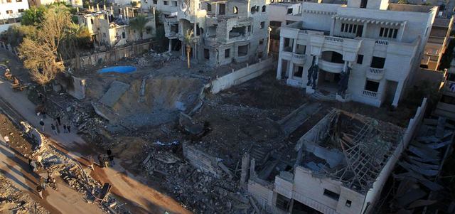 صور الدمار بسبب العدوان الإسرائيلي على غزة كانت صادمة مع استشهاد 2100 مدني فلسطيني أغلبيتهم من النساء والأطفال. أ.ف.ب