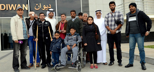 المصابون العراقيون لدى وصولهم الدولة. وام