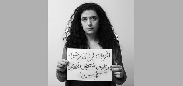 ناشطة تطالب بإطلاق سراح معتقلة سياسية. أرشيفية