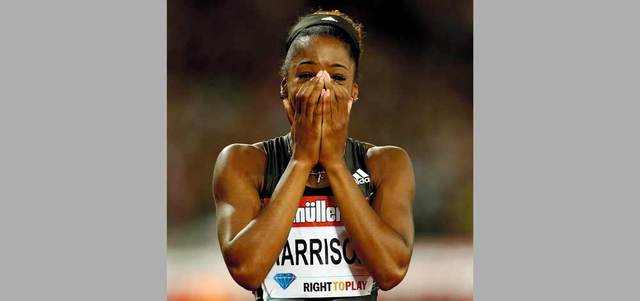 هاريسون عوضت الغياب عن الأولمبياد برقم قياسي عالمي. رويترز