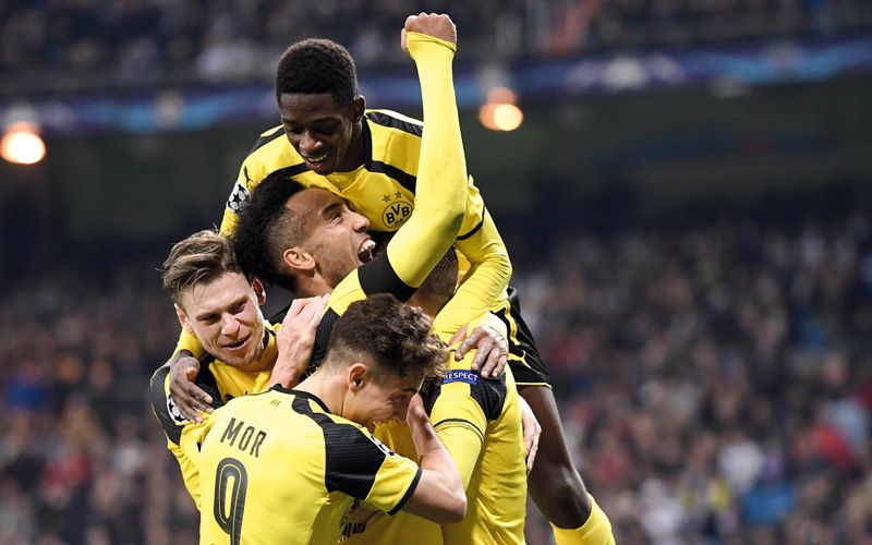 فرحة كبيرة للاعبي دورتموند بعد تحقيق تعادل مثير أمام الريال. أ.ف.ب