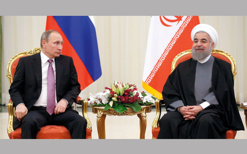 بوتين مع الرئيس الإيراني حسن روحاني. غيتي