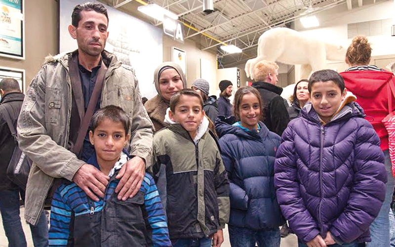 مصطفى حجي مع أفراد عائلته في كندا. أرشيفية